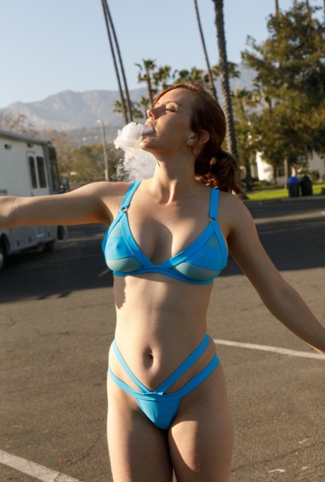 Cute amateur babe Kayla Coyote teases with her amazing tits in a blue bikini